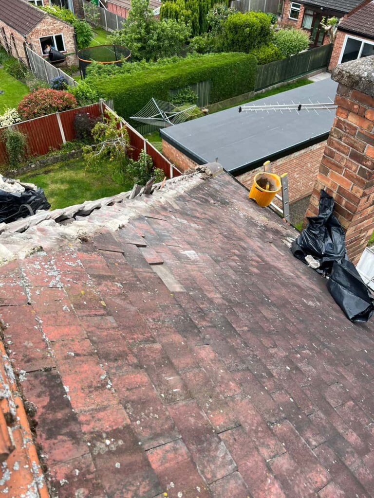 This is a photo of a roof where the hip tiles have been removed, and are just about to be replaced. Works carried out by Ravenshead Roofing Repairs